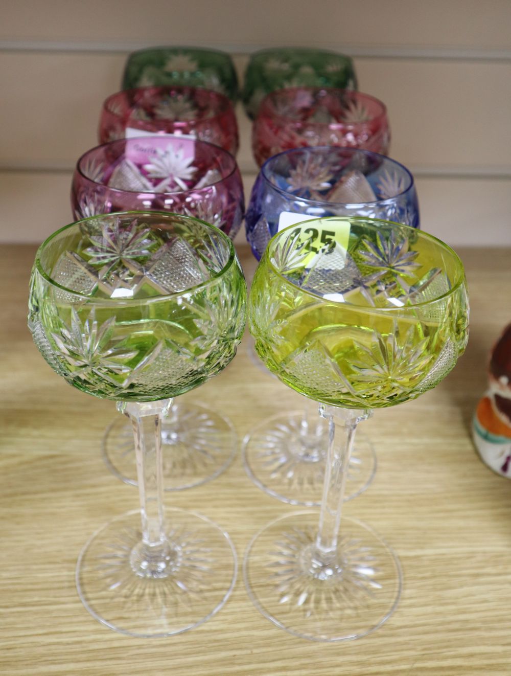 A set of eight hock glasses, with various coloured flash cut bowls